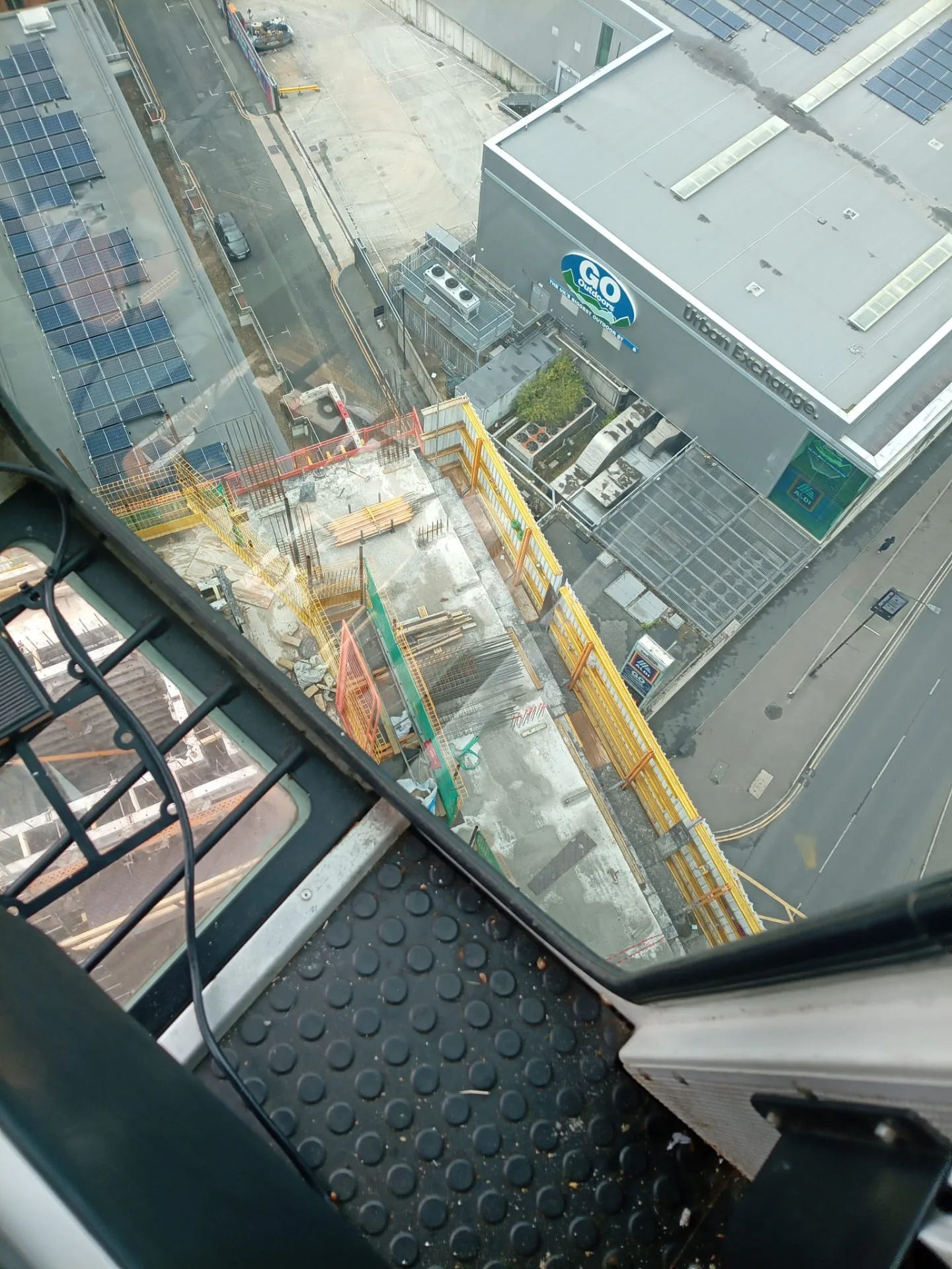 Looking down from a crane cab onto the site below