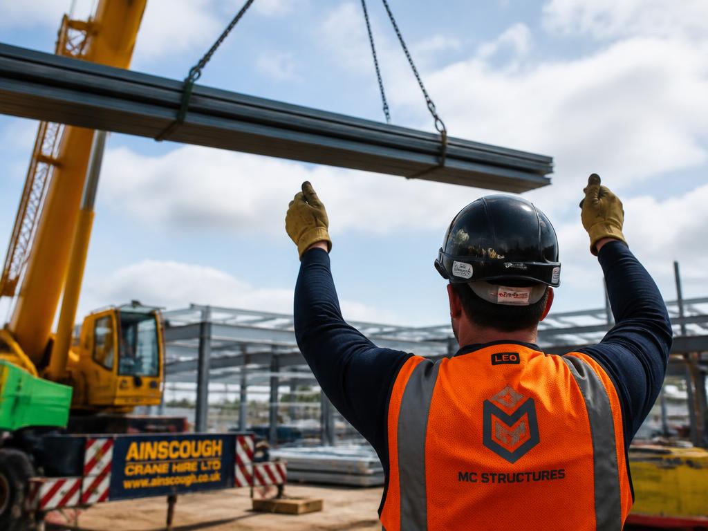 Slinger Signaller Guiding A Crane Lift